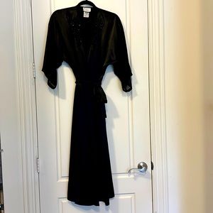 Satin-like feel for a long 100% polyester robe. Sheer 3/4 length sleeves.